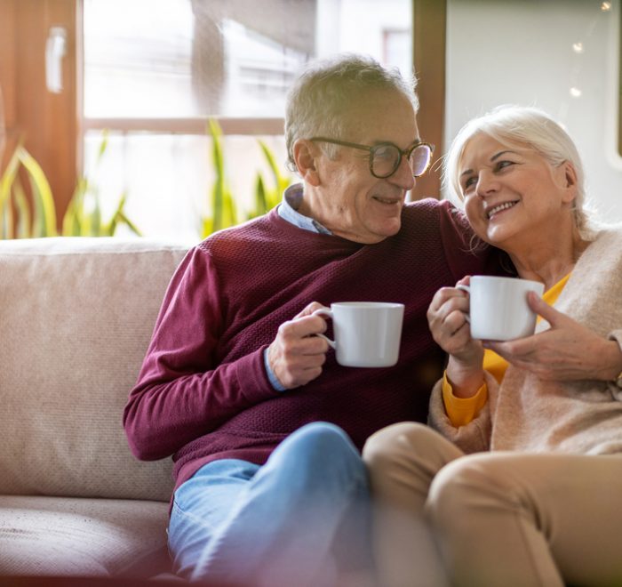 portrait of a happy elderly couple relaxing after choosing equity